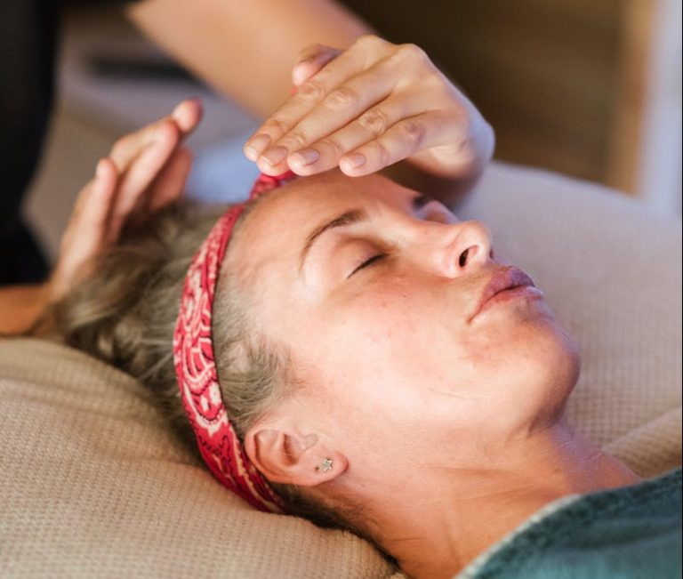 Relaxed woman getting alternative massage